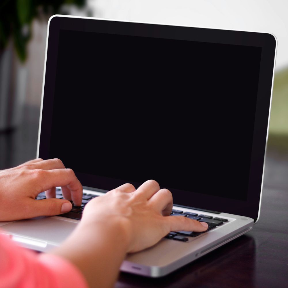 Person typing on a laptop